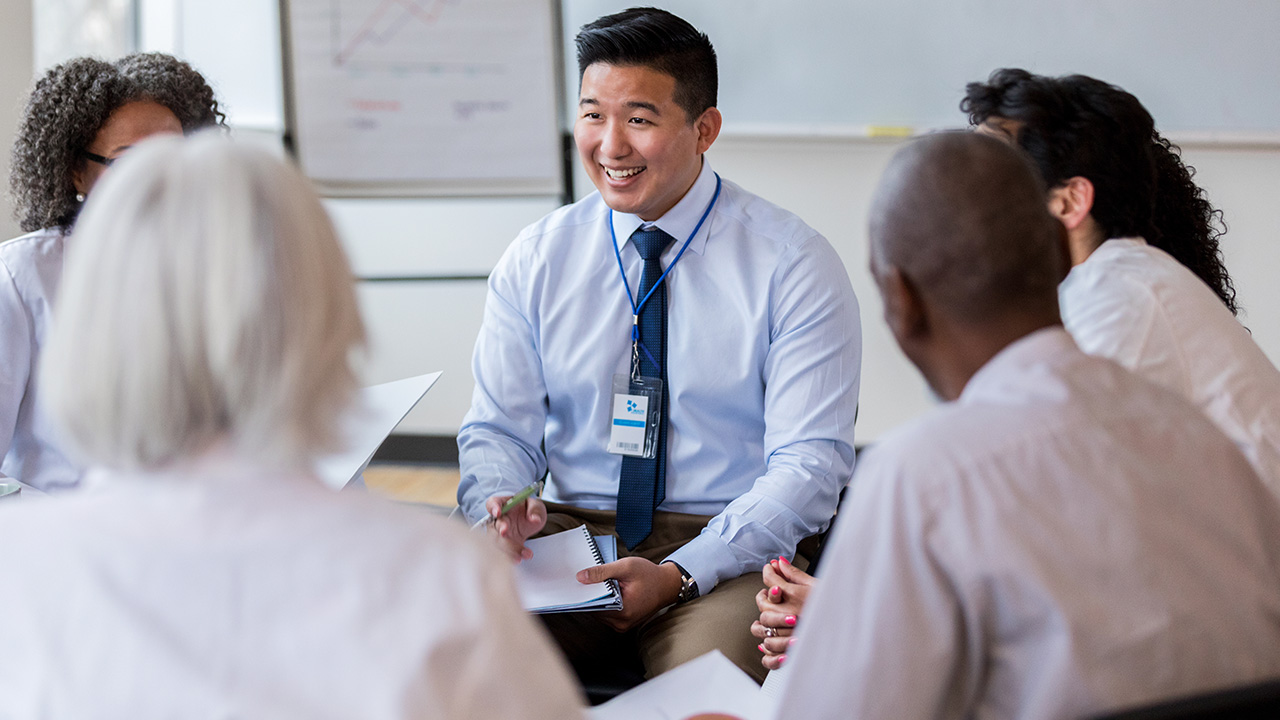 Physicians talking in circle